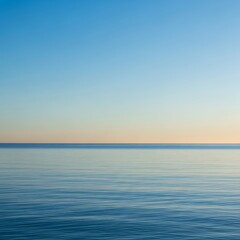 Naklejka premium Calm Horizon Over Still Water, Peaceful Blue Sky.