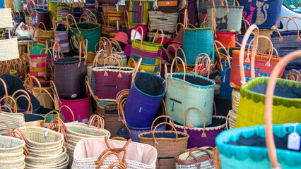 Colorful handmade wicker baskets on sale at local market 
