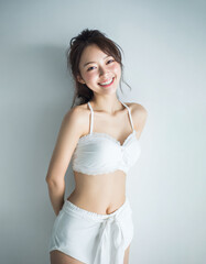 Fototapeta premium A smiling Japanese woman exuding joy, with a playful expression. This concept captures vibrant energy, innocence, and fun, creating a positive and uplifting mood.