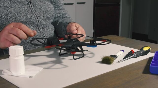Inspecting and testing drone wing blades at home to ensure optimal performance after a flight. Tools and techniques used for thorough examination and maintenance.