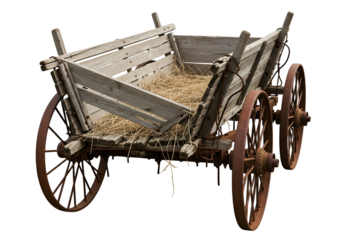 A weathered wooden wagon, laden with straw, displays the passage of time in its aged wood and rusted metal components.
