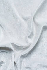 closeup of white velvet fabric, draped white velour fabric