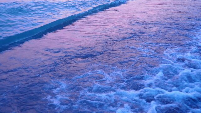 Morning light reflects off gentle waves as they break softly on the sandy shores of Canj, Montenegro. A peaceful moment unfolds along the Adriatic, inviting relaxation and connection with nature