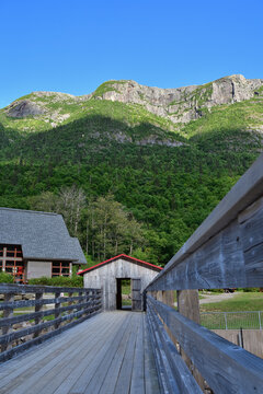 The Acropole des Draveurs Erables mountain in Hautes Gorges de la Riviere&nbsp;Malbaie National Park, Charlevoix Quebec&nbsp;Canada. SEPAQ. Wooden bridge above dam.
