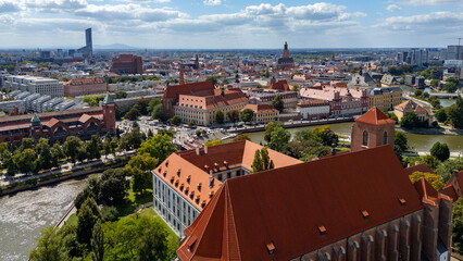 Aerial panorama of Wrocław, view of the Oder River, Ostrów Tumski and historic red rooftops, modern skyscrapers in background, Lower Silesia, Poland, cityscape © Adam