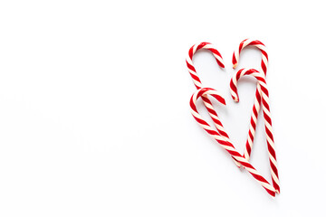 Obraz premium Christmas Candy Canes on white background, top view