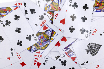 playing cards background, playing cards randomly scattered flat lay.