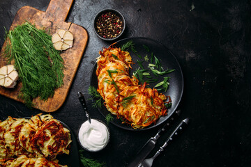 Golden Potato Pancakes with Sour Cream . draniki
