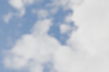 Soft, pastel sky with fluffy clouds. Blurry, diffused light