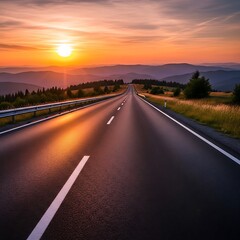 Naklejka premium Road leading to sunset over mountains
