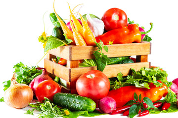 Fresh shiny different vegetables in a wooden crate. Isolated on white background.