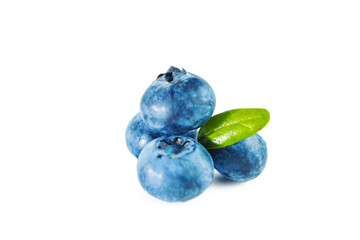 Ripe fresh blueberries with leaves isolated on white.