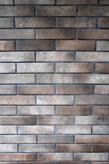 The texture of vintage brick wall with residual elements of plaster concrete decoration