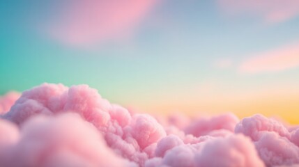 Soft pink clouds under a colorful sky at sunset
