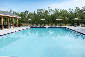 Big swimming pool umbrellas in background