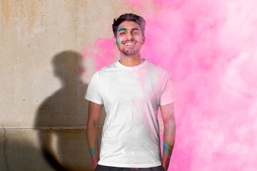 Obraz premium Man wearing white shirt, holi day celebration concept