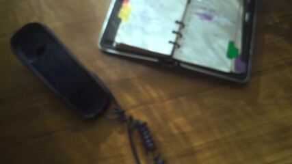 Telephone user calls contact numbers on retro push button handset