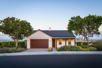 Obraz premium Charming suburban home with lush green landscaping and trees