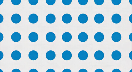 Blue polka dots arranged in a grid pattern on a white background creating a visually appealing design