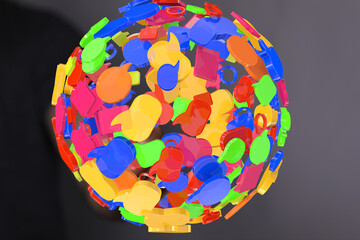 Abstract 3D illustration of colorful speech bubbles forming a sphere, symbolizing global communication and connection.