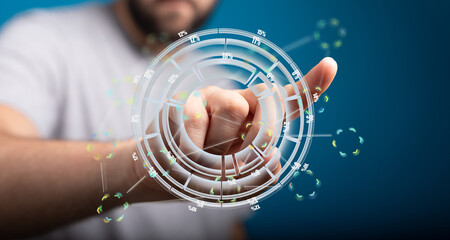 Close-up of a hand interacting with a holographic display showing data and percentages.