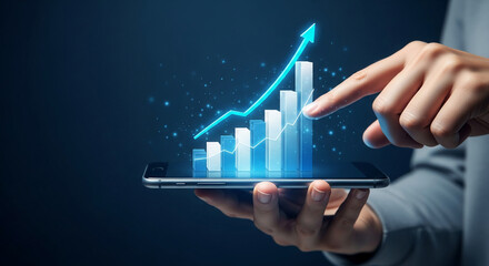 Hand holding smartphone displaying upward trending bar graph, symbolizing growth, success, and mobile technology in business