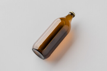 Mockup of a glass beer bottle on a neutral background.