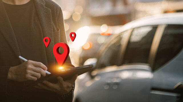 Businessman using tablet with location pin icons, GPS navigation and map tracking technology concept