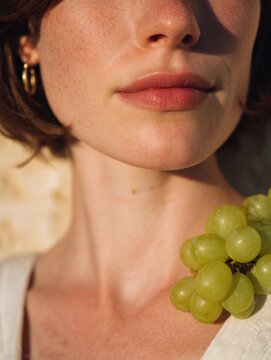 Editorial portrait of Italian woman with Mediterranean beauty and jewelry. Close-up photography with rustic background, inspired by Italian fashion and lifestyle