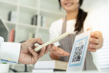 Customer use smartphones to scan QR codes to pay in-store with digital payments without cash. scanning get discounts. E wallet, technology, online payment, banking app, smart city, money transfer.