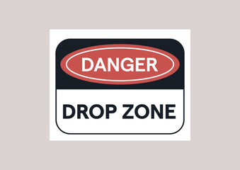 A prominently displayed sign warns of dangers in a designated drop zone, emphasizing the importance of safety in this area where objects may fall or be airborne