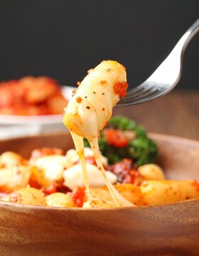 Cheesy Korean snack on a fork