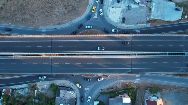 Top-down aerial Tirana highway ring road, flowing cars in different directions on a daily commuting life