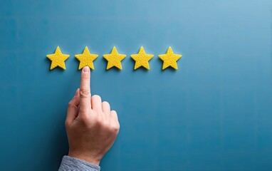 Hand pointing to four yellow stars