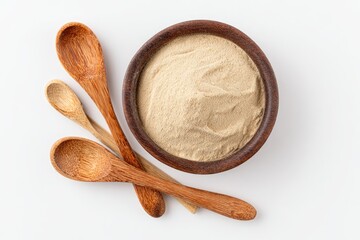 Wooden bowl with light beige powder and spoons