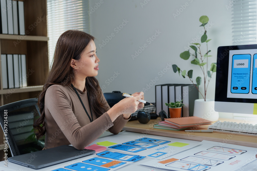 Poster asian woman working as mobile app developer, designing user experience of smartphone application in 