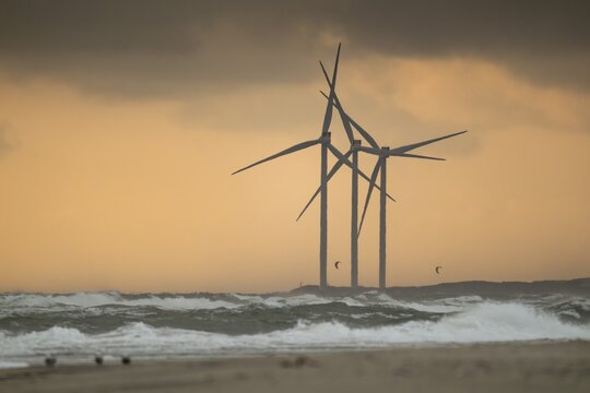 Waves, surf, beach, kite surfers, large wind turbines, wind turbines, evening mood, Hvide Sande, North Sea, Denmark