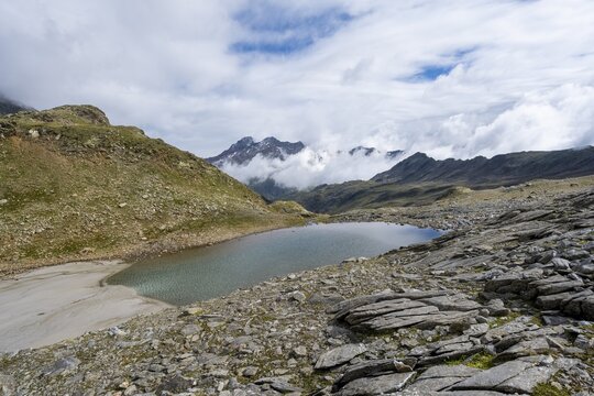 Mountain lake Hinterer Senner Egetsee, mountain landscape, seven-lake hike, Stubai Alps, near Ridnaun, South Tyrol, Italy