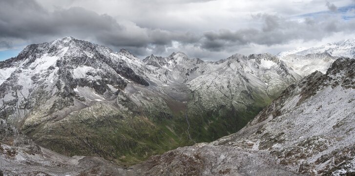 View of steep rocky mountain landscape with fresh snow in summer, in the Hornscharte, on the Wiener H&ouml;henweg, behind summit Roter Knopf, Schober group, Hohe Tauern National Park, Carinthia, Austria