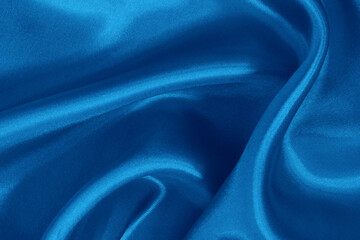 Blue fabric cloth texture for background and design art work, beautiful crumpled pattern of silk or linen.