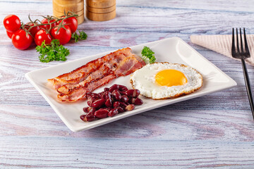 English breakfast with egg, bean and bacon