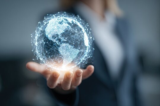Hand holding a glowing digital Earth globe, representing global network and data connection. - Powered by Adobe