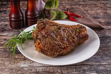Baked beef steak on the bone