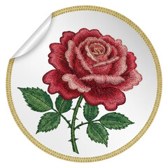 An embroidered rose sticker ready to be peeled and placed