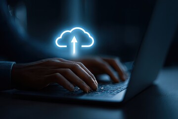 Businessman hands typing on laptop keyboard uploading data to online cloud storage service.