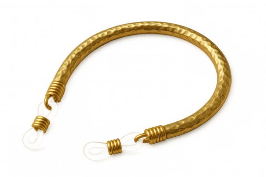 Damaged golden bracelet lying on transparent surface, highlighting delicate luxury jewelry design