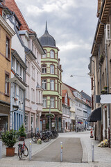 Naklejka premium Historic German street with colorful old houses, bicycles and narrow cobblestone road