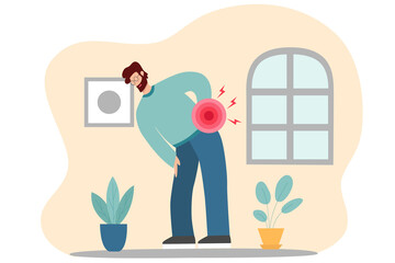 Man holding hand on lumbar spine, lower back pain.