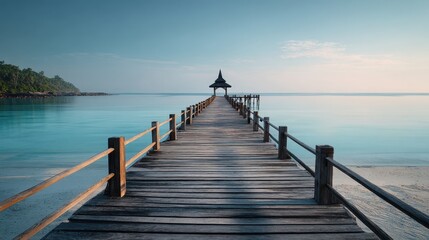 Fototapeta premium Tranquil Wooden Pier Extending into Calm Blue Ocean at Sunrise