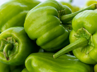 Close-up view of organic green bell peppers.